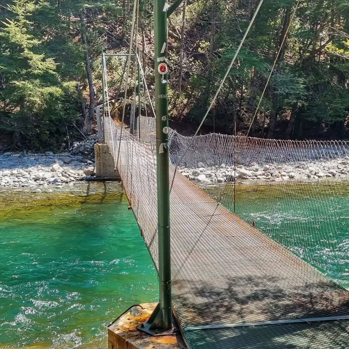 Wooden suspension bridge over the Blanco River on the Refugio Motoco trail near El Bolsón