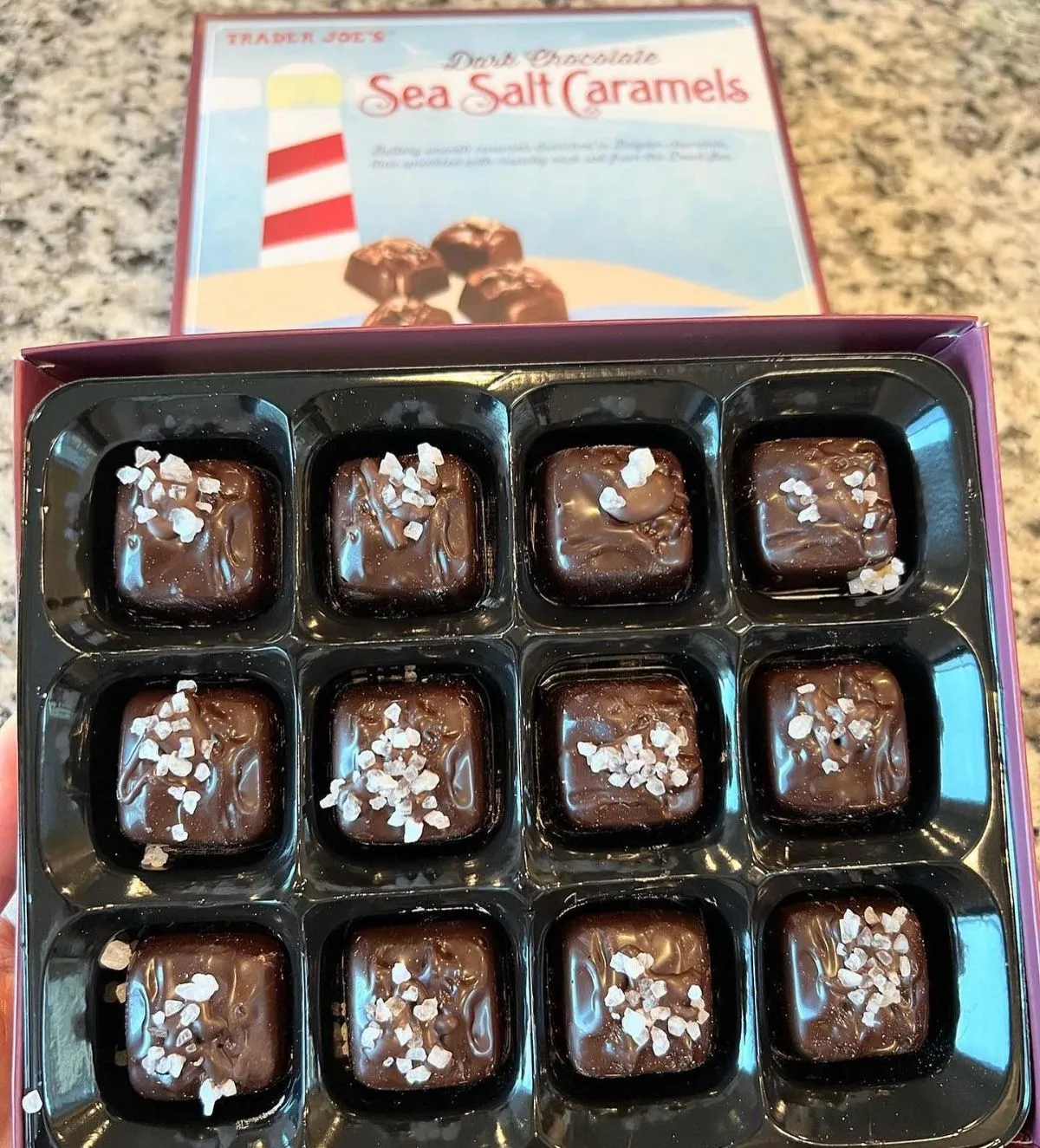 Macro view of dark chocolate with sea salt on a slate board