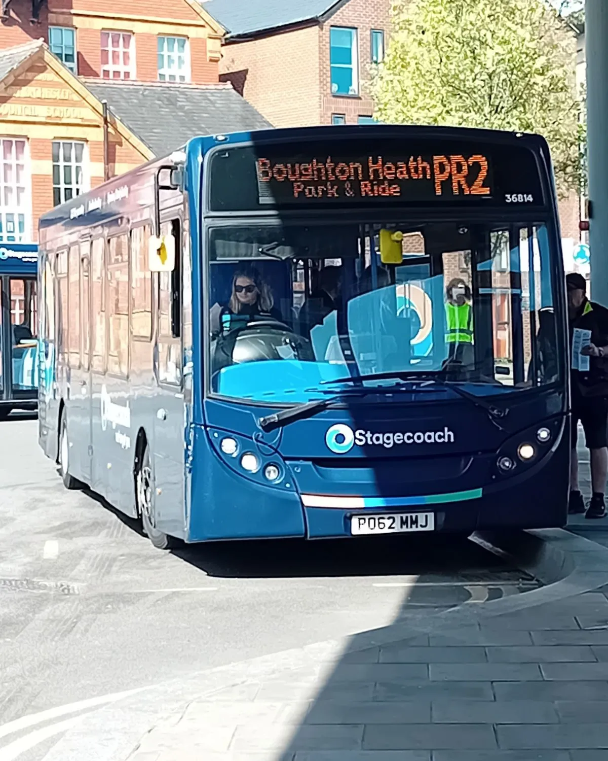 A local bus at a stop ready to take passengers to Culross Village