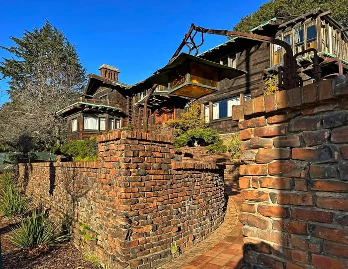 Exterior view of the historic Thorsen House showing detailed woodwork and brickwork in Berkeley