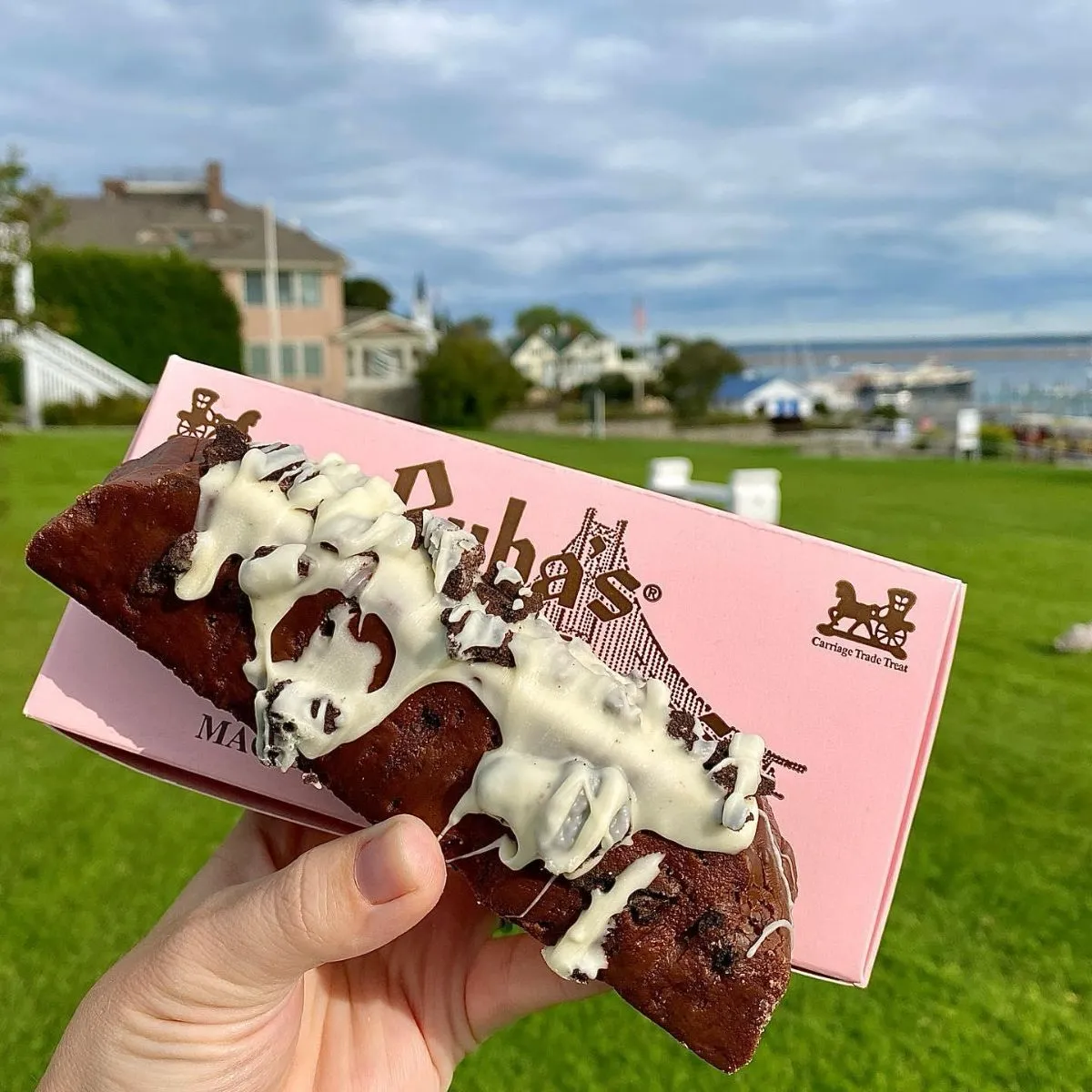 Close-up of freshly sliced chocolate fudge on a wooden counter