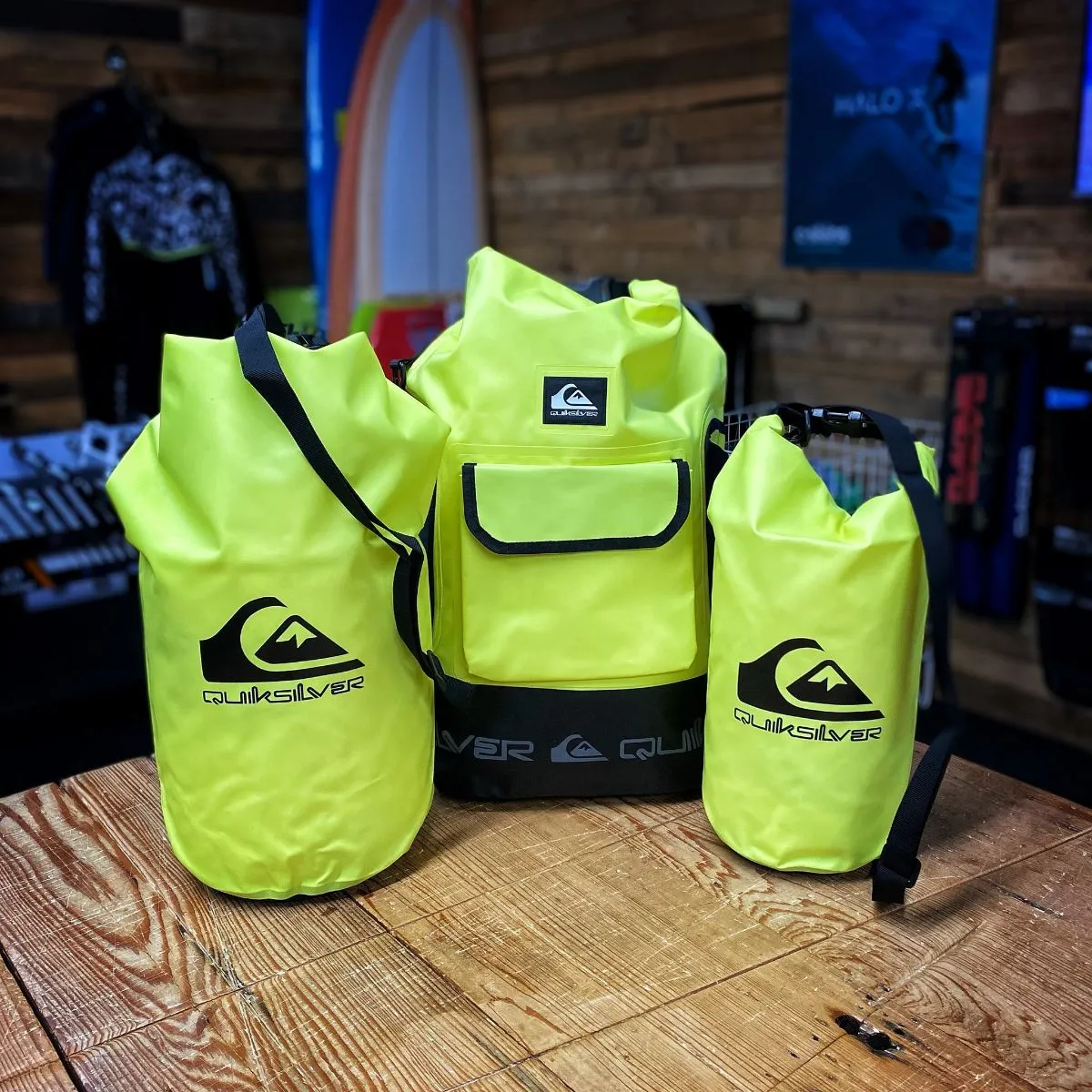 Bright waterproof dry bags on pebble beach near the Aare River