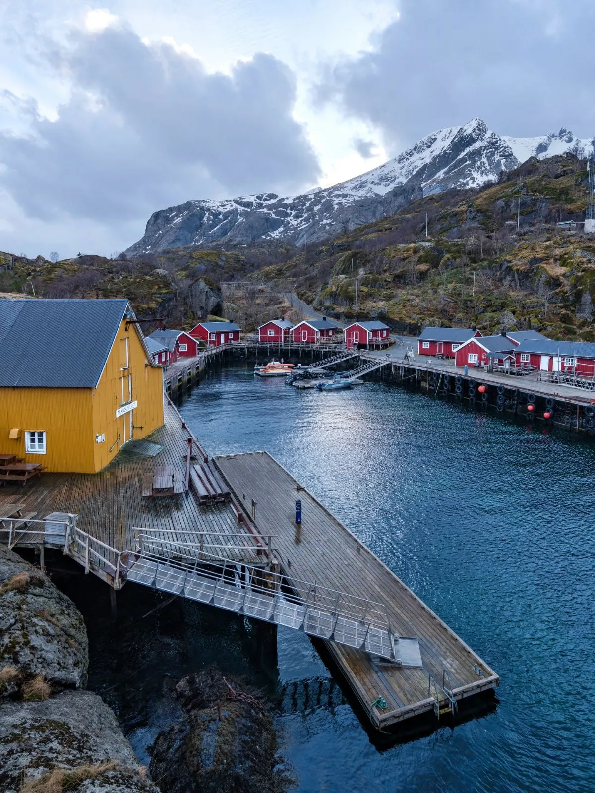 Traditional colorful fishing cabins along the peaceful harbor of Skrova island