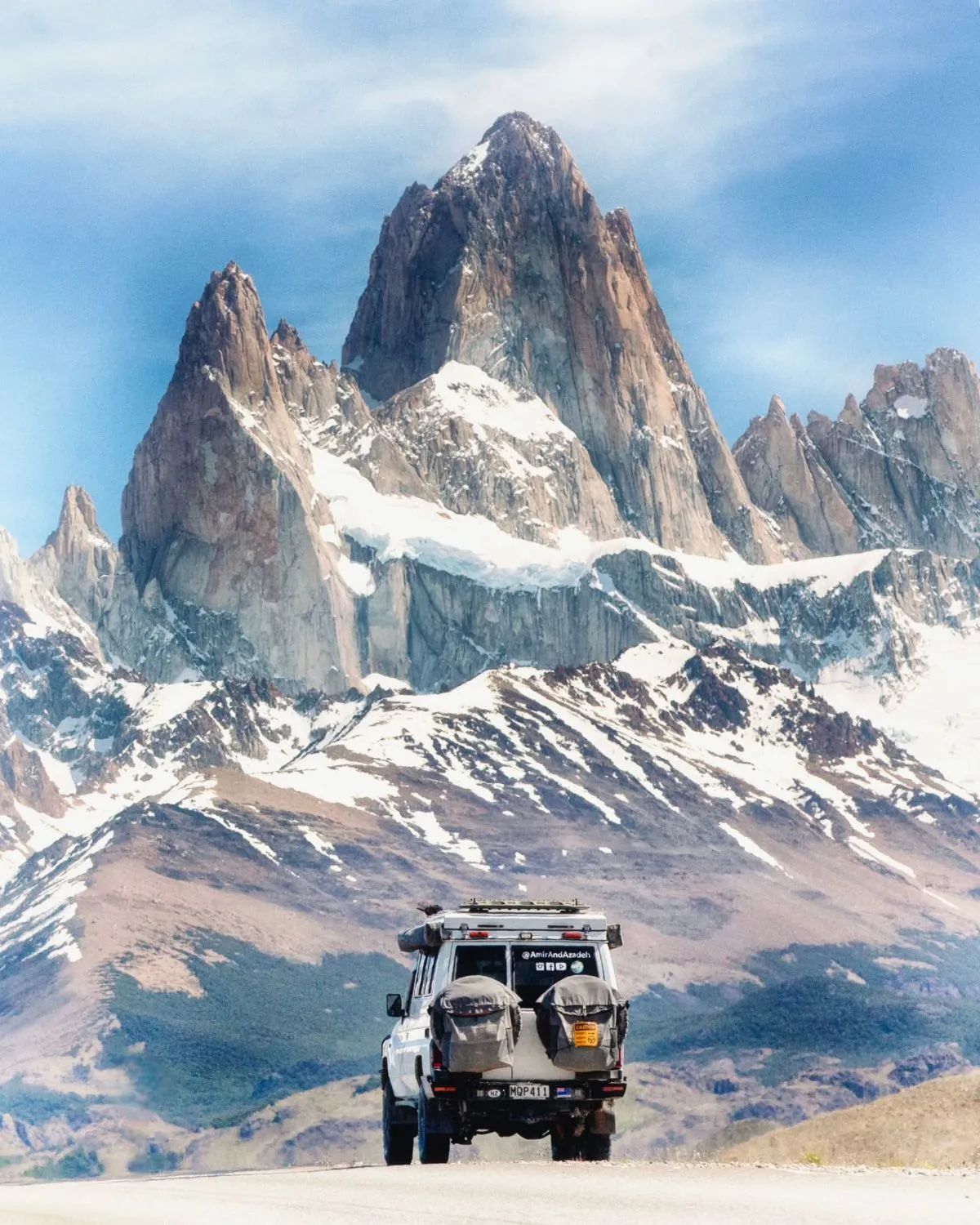 A rugged 4x4 vehicle exploring the Patagonian landscape near Estancia Cristina with views of the Upsala Glacier during summer.