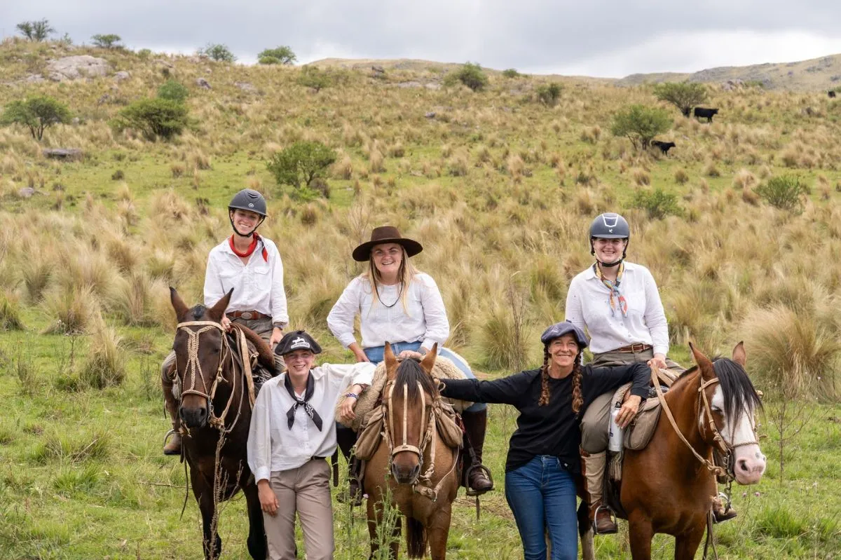 Family riding Paso Peruano horses at Estancia Los Potreros in Argentina