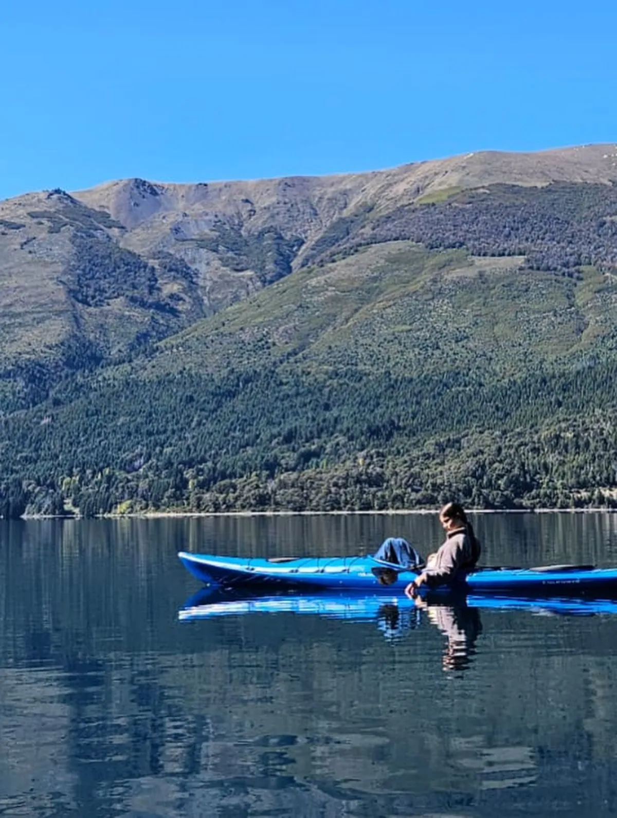 Yellow kayak on the clear waters of Lake Gutierrez in Patagonia