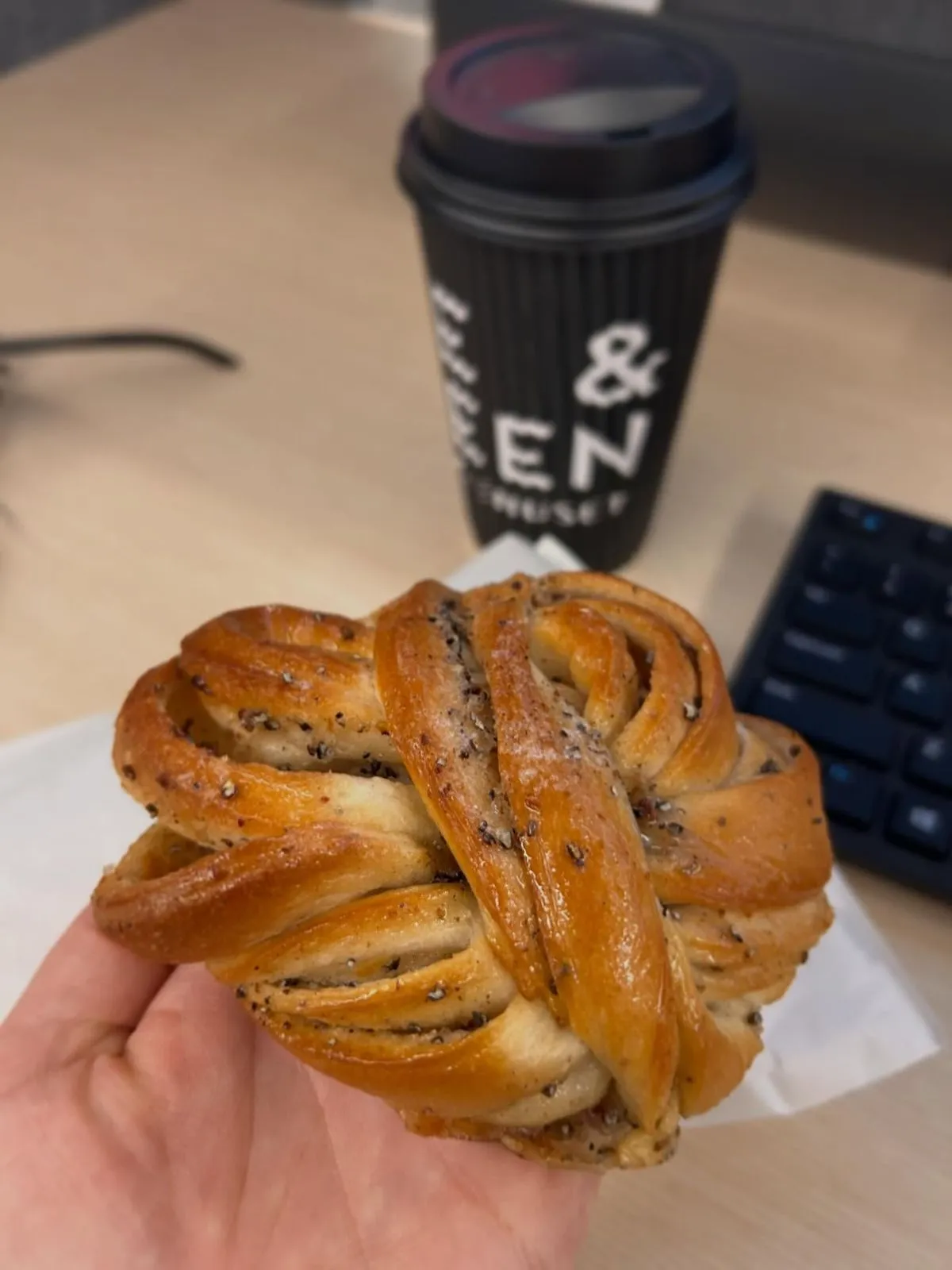 Traditional Norwegian cardamom bun and coffee at a local cafe