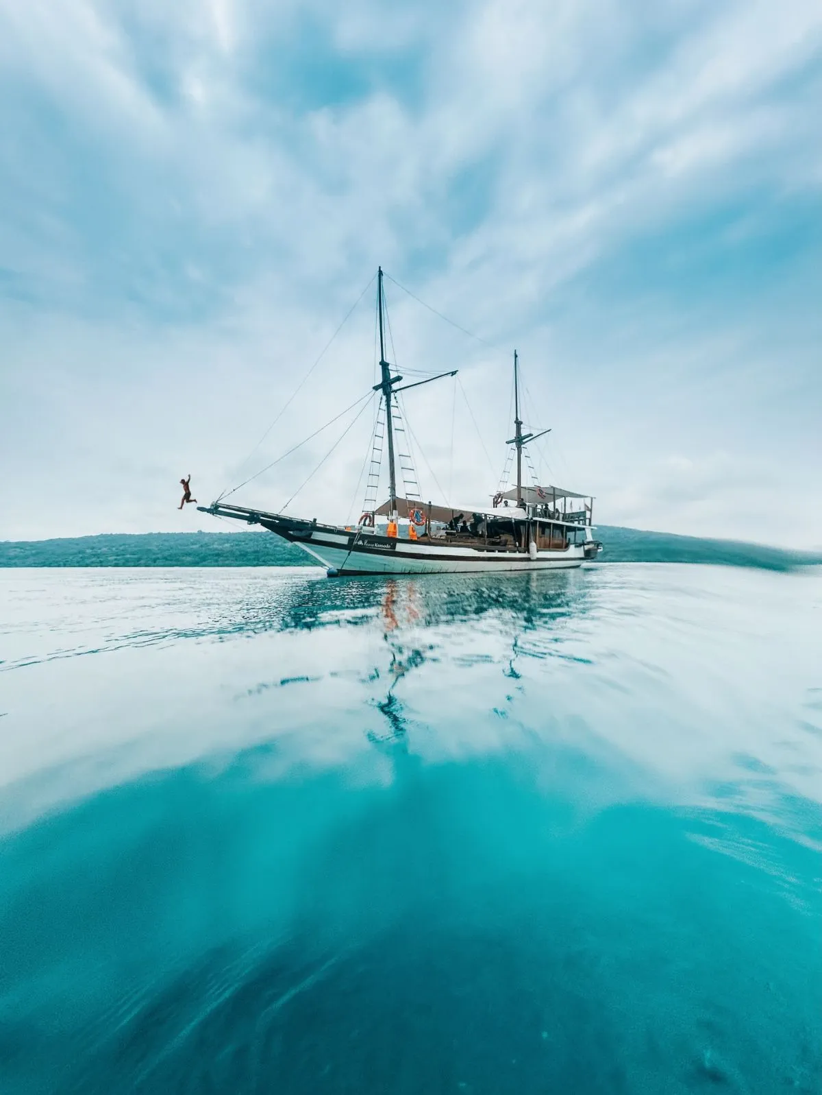 Traditional wooden Jukung boat near Menjangan Island shores