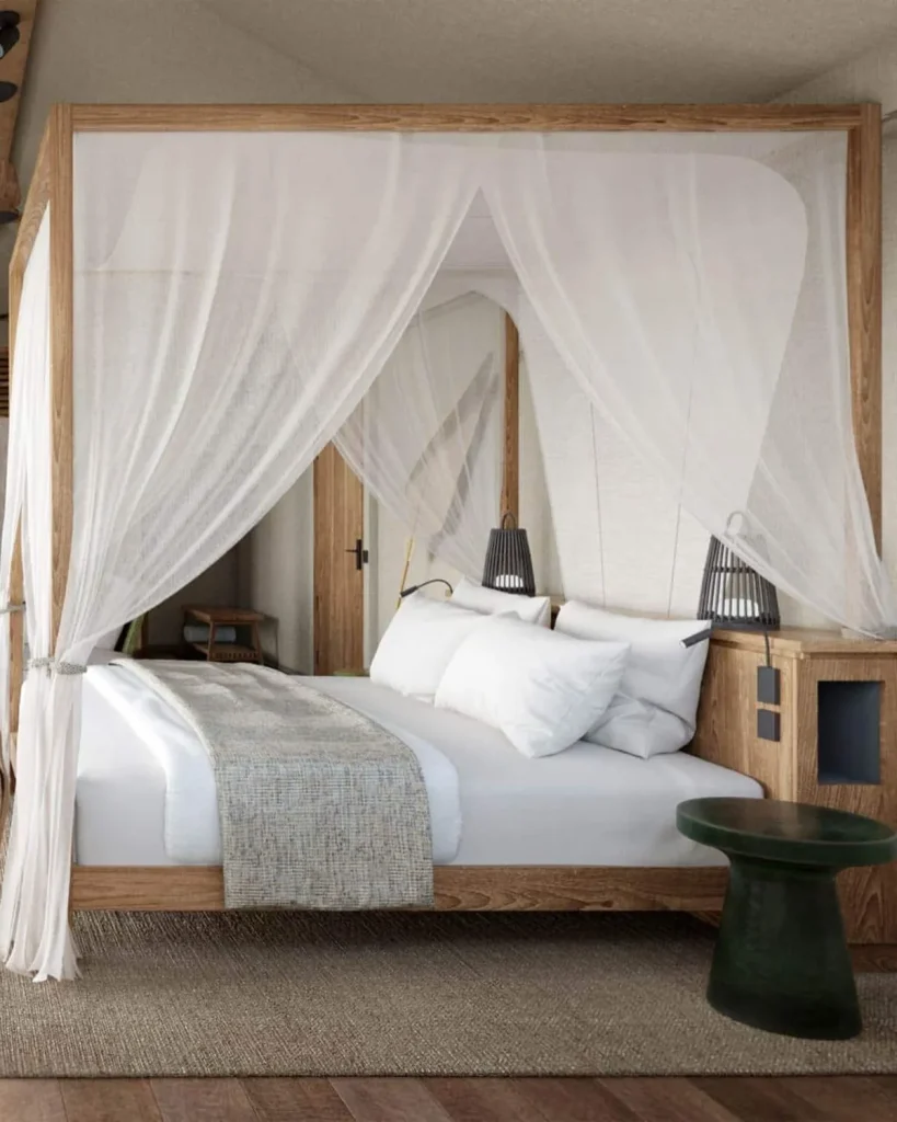 Modern minimalist resort room with a private balcony overlooking the ocean at sunset in Haad Rin, Koh Phangan, offering a luxury stay near the Full Moon Party.